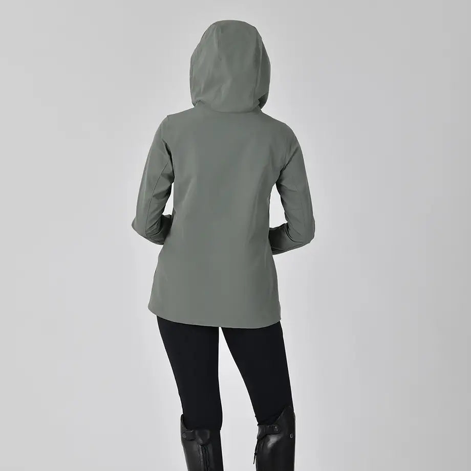 Person wearing a gray raincoat, black leggings, and black rain boots on a white background
