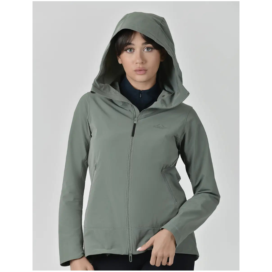 Woman wearing a green hooded jacket on a gray background