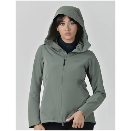 Woman wearing a green hooded jacket on a gray background