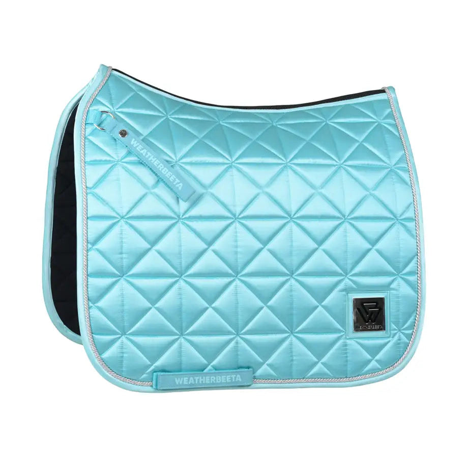 Light blue quilted saddle pad with 'WeatherBeeta' branding on a white background