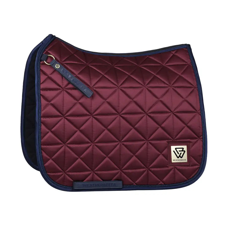 Maroon quilted saddle pad with navy border on a white background