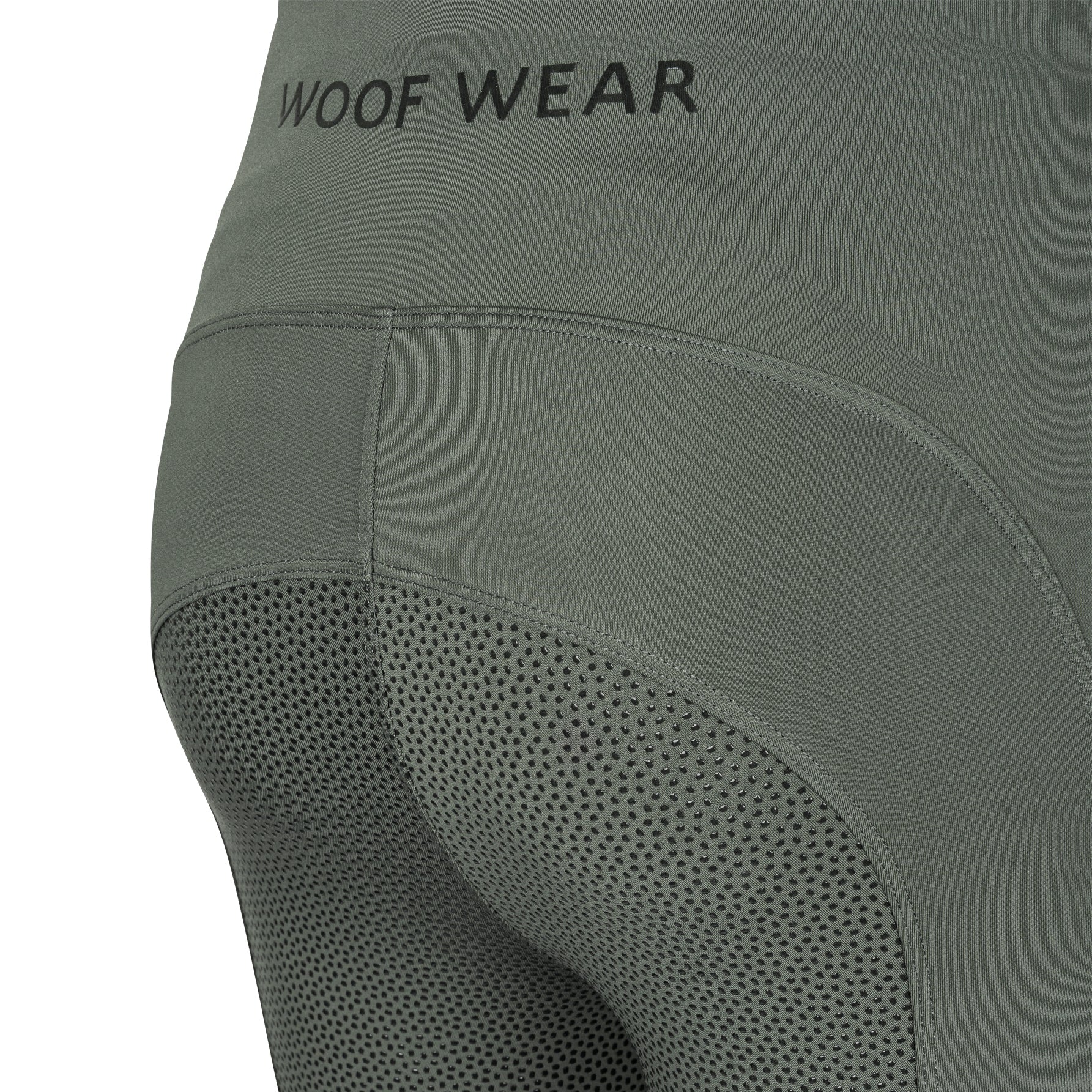Green leggings with 'WOOF WEAR' branding on a white background